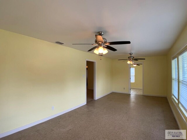 205 W Beck Ave, Harlingen, TX 78550 - spare room with baseboards and a ceiling fan
