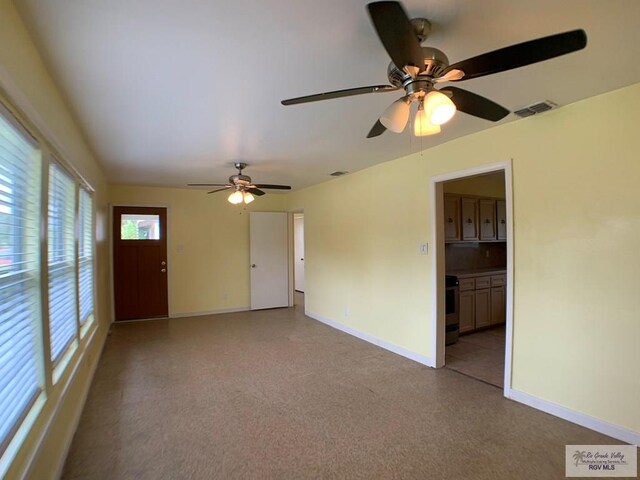 205 W Beck Ave, Harlingen, TX 78550 - spare room with baseboards and a ceiling fan