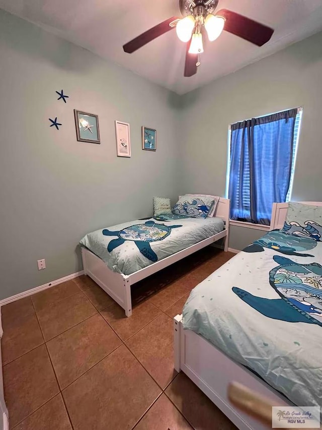 tiled bedroom with ceiling fan