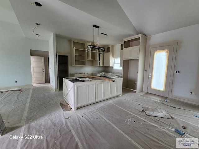 9848 Heights N, Harlingen, TX 78552 - kitchen featuring a kitchen island, white cabinets, open shelves, and decorative light fixtures