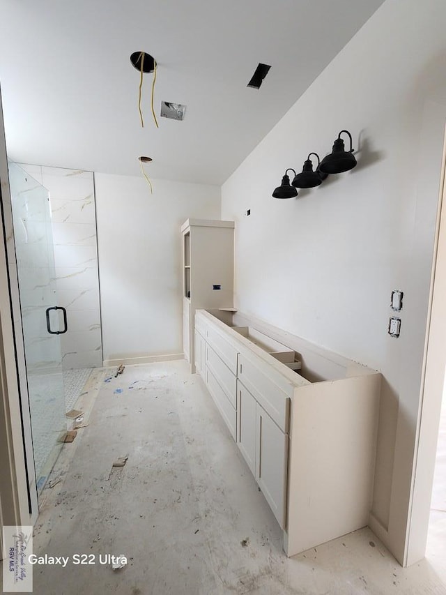 9848 Heights N, Harlingen, TX 78552 - bathroom featuring a marble finish shower and vanity