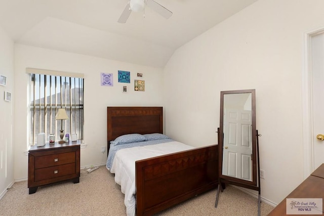 bedroom with a ceiling fan, lofted ceiling, light colored carpet, and baseboards