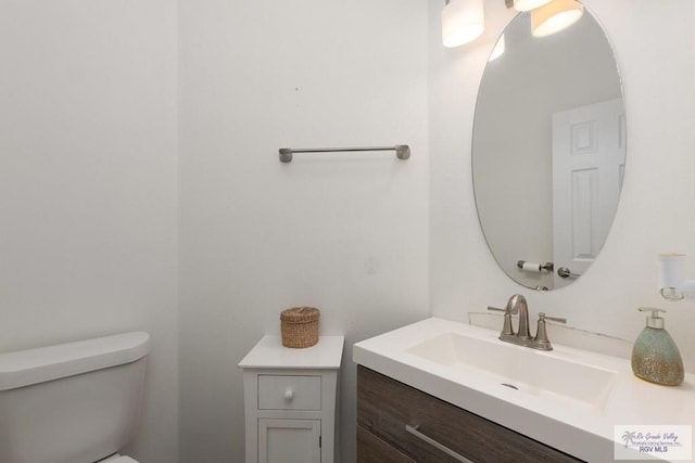 half bath with toilet and vanity