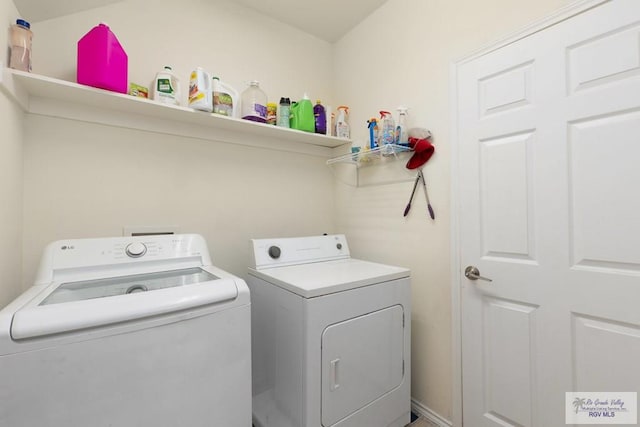 laundry area with laundry area and separate washer and dryer