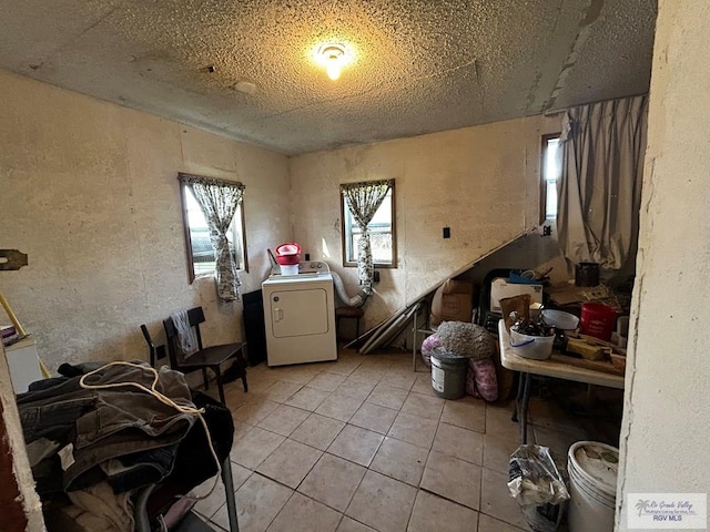 misc room with light tile patterned flooring and washer / clothes dryer