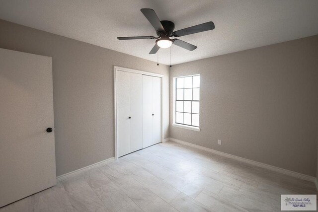 23919 Ellie Ln, Harlingen, TX 78552 - unfurnished bedroom featuring a closet, baseboards, and a ceiling fan