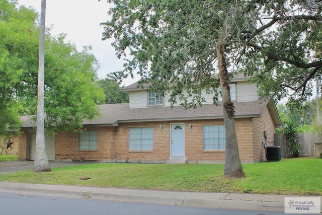 1725 Peach Tree Ct, Harlingen, TX 78550 - view of front of house featuring brick siding, a shingled roof, and central AC unit