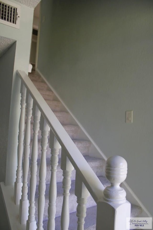 1725 Peach Tree Ct, Harlingen, TX 78550 - stairs featuring baseboards