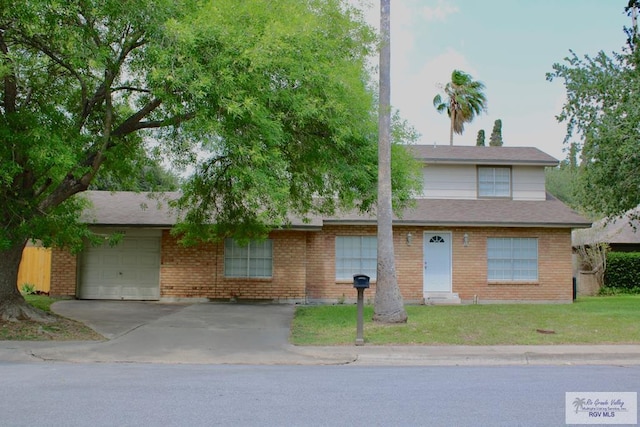 1725 Peach Tree Ct, Harlingen, TX 78550 - view of front of house with an attached garage, brick siding, concrete driveway, and a front lawn