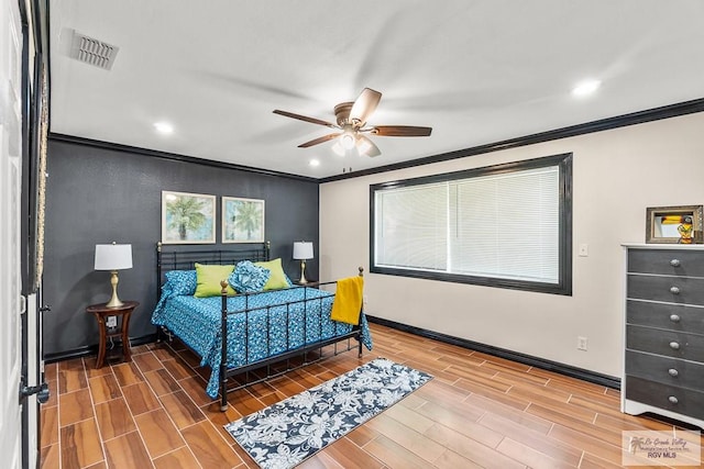 bedroom featuring ceiling fan, wood-type flooring, and ornamental molding