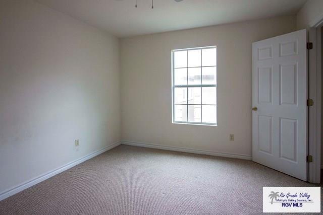 spare room with light colored carpet