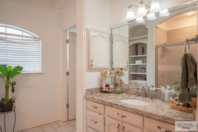 26343 Kansas City Rd Unit 3, La Feria, TX 78559 - bathroom featuring vanity, plenty of natural light, and tile patterned flooring