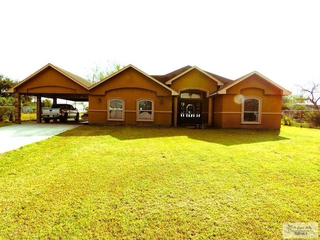 single story home with a front lawn and a carport