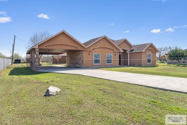 ranch-style home with a carport and a front yard