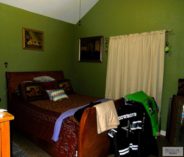 bedroom featuring lofted ceiling