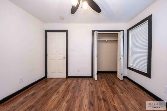 unfurnished bedroom with a closet, ceiling fan, baseboards, and wood finished floors