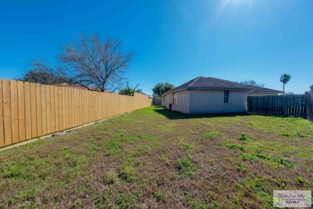 view of yard featuring a fenced backyard