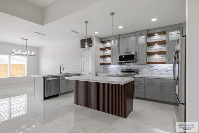 kitchen with decorative backsplash, open shelves, gray cabinetry, stainless steel appliances, and marble finish floor