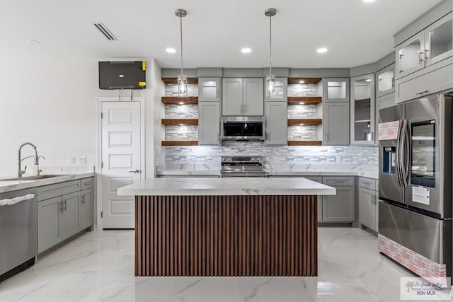 kitchen with gray cabinetry, stainless steel appliances, open shelves, and a sink