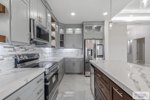 kitchen featuring recessed lighting, light stone countertops, decorative backsplash, stainless steel appliances, and marble finish floor