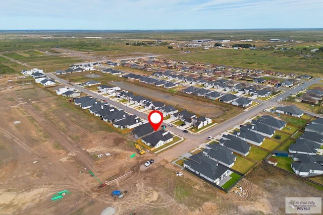 birds eye view of property with a residential view