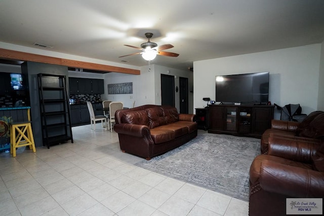 living room with light tile patterned floors and ceiling fan