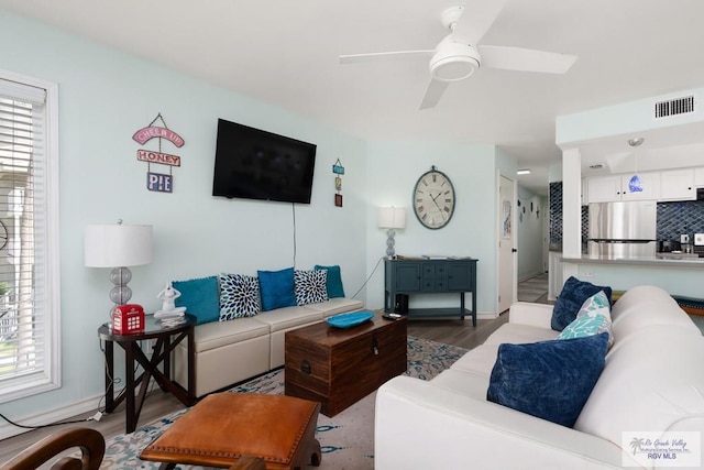 200 Padre Blvd Unit 1206, South Padre Island, TX 78597 - living room featuring wood finished floors, healthy amount of natural light, a ceiling fan, and baseboards