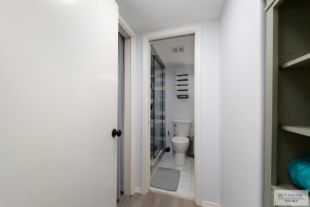 200 Padre Blvd Unit 1206, South Padre Island, TX 78597 - full bathroom with a shower stall, toilet, and baseboards