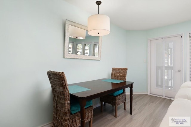 200 Padre Blvd Unit 1206, South Padre Island, TX 78597 - dining room with light wood-type flooring and baseboards