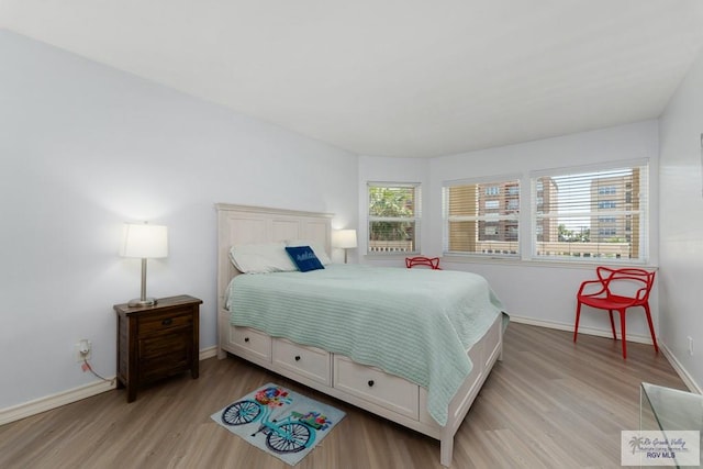 200 Padre Blvd Unit 1206, South Padre Island, TX 78597 - bedroom with light wood-type flooring and baseboards