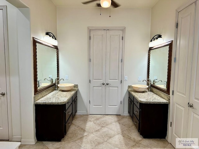 bathroom featuring tile patterned floors, ceiling fan, and vanity