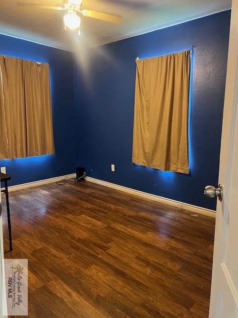1327 W Johnson Ave, Harlingen, TX 78550 - empty room with wood finished floors, a ceiling fan, and baseboards