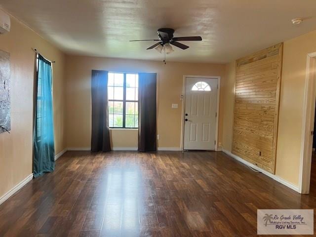 1327 W Johnson Ave, Harlingen, TX 78550 - entryway featuring a ceiling fan, dark wood-type flooring, and baseboards