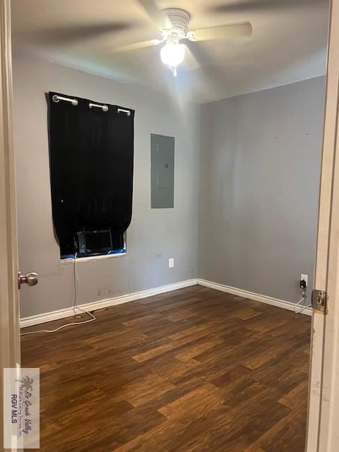 1327 W Johnson Ave, Harlingen, TX 78550 - empty room with electric panel, baseboards, ceiling fan, and dark wood finished floors
