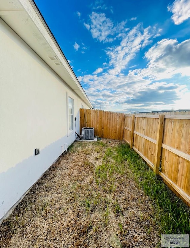 view of yard featuring central AC