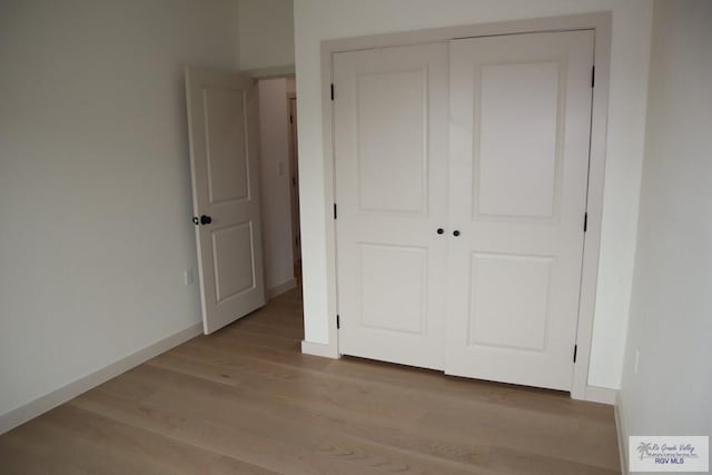 13953 Isaiah Ct, La Feria, TX 78559 - unfurnished bedroom featuring light wood-style flooring and a closet