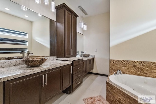 2540 Los Portales Dr, Brownsville, TX 78526 - full bath with vanity, a whirlpool tub, and tile patterned floors