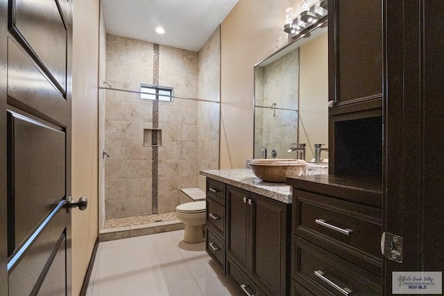 2540 Los Portales Dr, Brownsville, TX 78526 - bathroom with toilet, vanity, and tiled shower