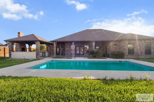 2540 Los Portales Dr, Brownsville, TX 78526 - outdoor pool with a gazebo, french doors, and a patio