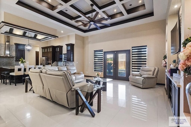 2540 Los Portales Dr, Brownsville, TX 78526 - living room featuring a towering ceiling, coffered ceiling, french doors, beamed ceiling, and light tile patterned flooring