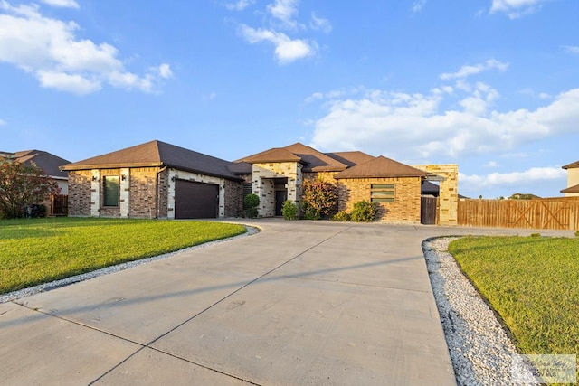 2540 Los Portales Dr, Brownsville, TX 78526 - view of front of property with brick siding, a garage, driveway, and a gate