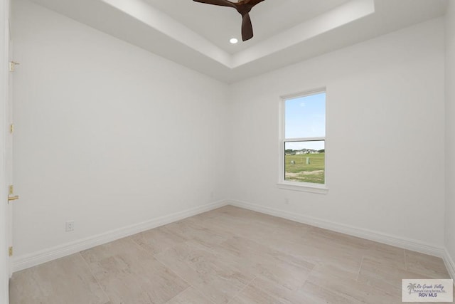 5407 Common Ln, Weslaco, TX 78596 - spare room with a tray ceiling, ceiling fan, and recessed lighting