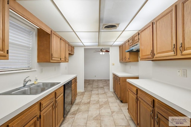 kitchen featuring light tile patterned floors, black dishwasher, ceiling fan, and sink