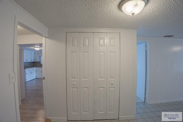 802 California St, Harlingen, TX 78552 - hall with baseboards, wood finished floors, and a textured ceiling