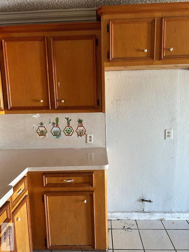 kitchen with light tile patterned floors