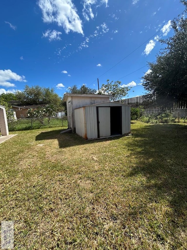 view of outbuilding with a yard