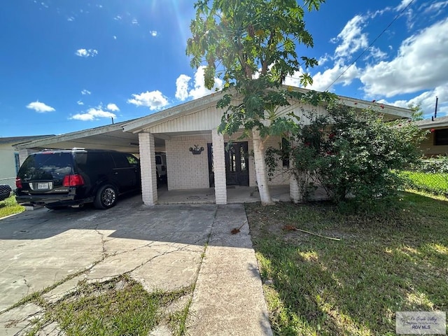 view of front of property with a carport