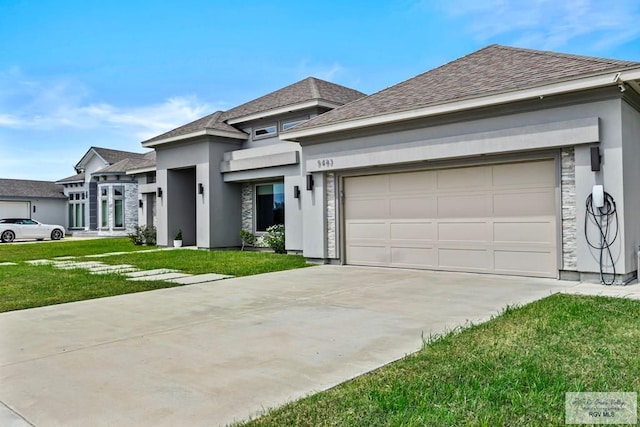 5483 Lovers Ln, Brownsville, TX 78526 - prairie-style home featuring roof with shingles, driveway, stucco siding, and a garage