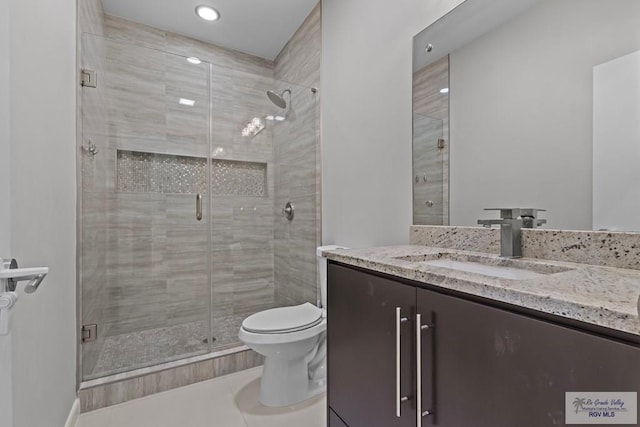 5483 Lovers Ln, Brownsville, TX 78526 - bathroom with vanity, a shower stall, tile patterned floors, and recessed lighting