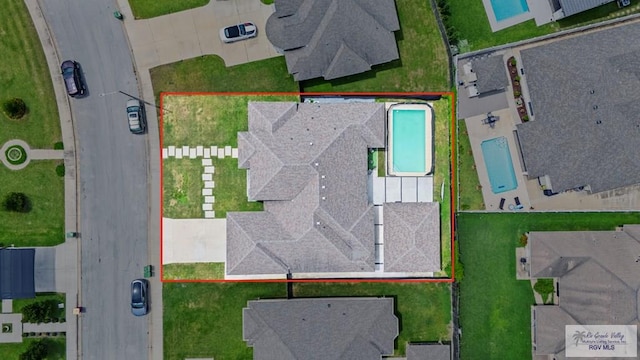 5483 Lovers Ln, Brownsville, TX 78526 - aerial view of residential area with property parcel outlined and a pool area